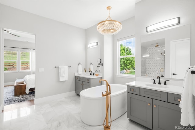 4868 Hogback Ridge Rd, Morrison, CO 80465 - ensuite bathroom with a stall shower, a soaking tub, marble finish floors, and two vanities
