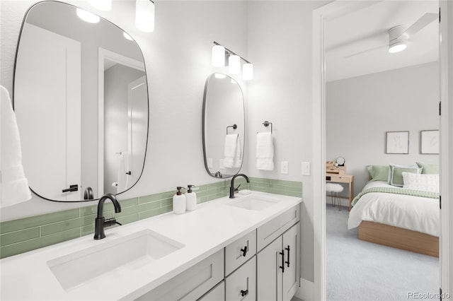 4868 Hogback Ridge Rd, Morrison, CO 80465 - full bath featuring decorative backsplash, ensuite bath, and double vanity