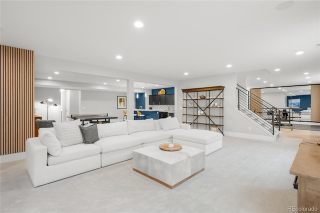 4868 Hogback Ridge Rd, Morrison, CO 80465 - living area featuring stairs, recessed lighting, bar area, light carpet, and baseboards
