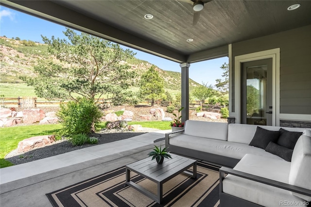 4868 Hogback Ridge Rd, Morrison, CO 80465 - view of patio featuring an outdoor hangout area, a mountain view, and a ceiling fan