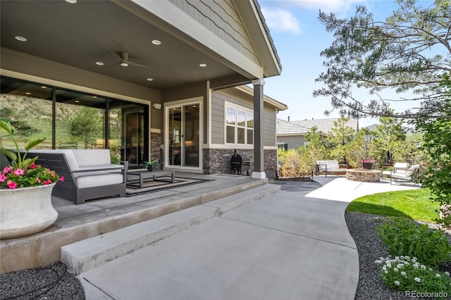 4868 Hogback Ridge Rd, Morrison, CO 80465 - view of patio / terrace featuring ceiling fan and an outdoor living space with a fire pit