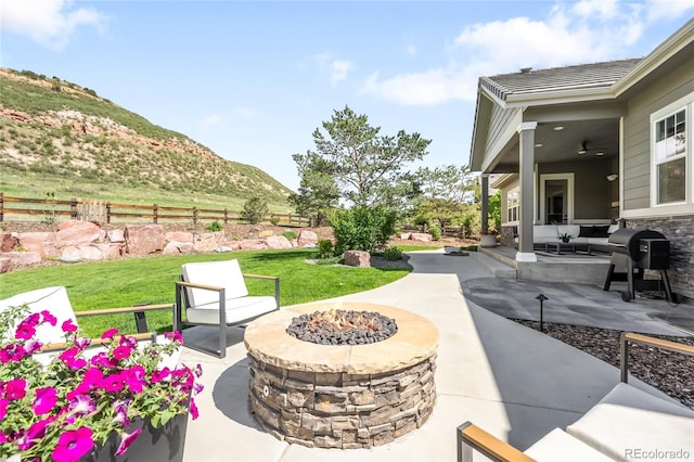 4868 Hogback Ridge Rd, Morrison, CO 80465 - view of patio / terrace featuring a fire pit, a mountain view, and area for grilling
