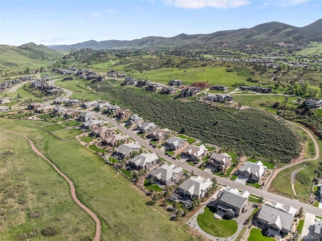 4868 Hogback Ridge Rd, Morrison, CO 80465 - aerial view of property's location featuring a mountain backdrop and nearby suburban area