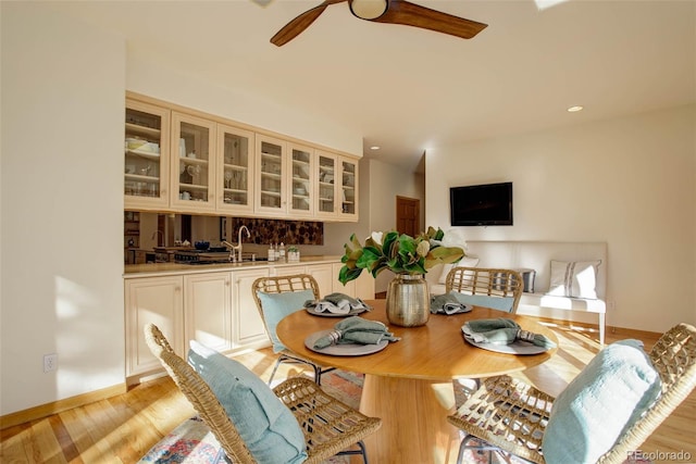 dining space with light hardwood / wood-style floors