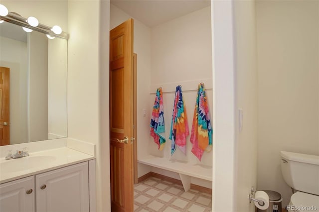 bathroom with toilet and vanity