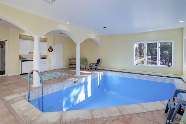 view of swimming pool featuring a hot tub