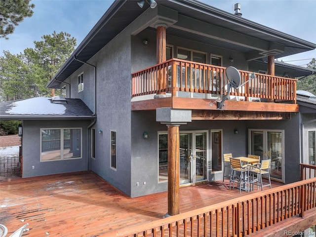 rear view of house featuring a deck