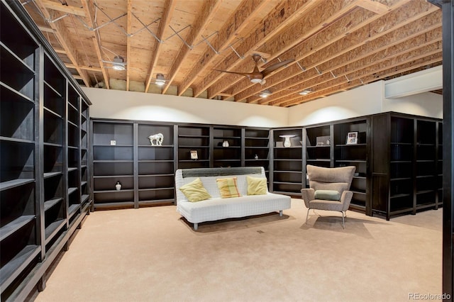 sitting room with a wall mounted AC and carpet floors