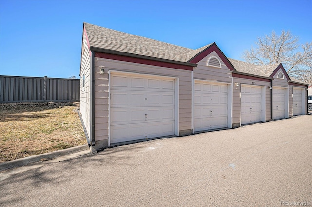 garage featuring fence