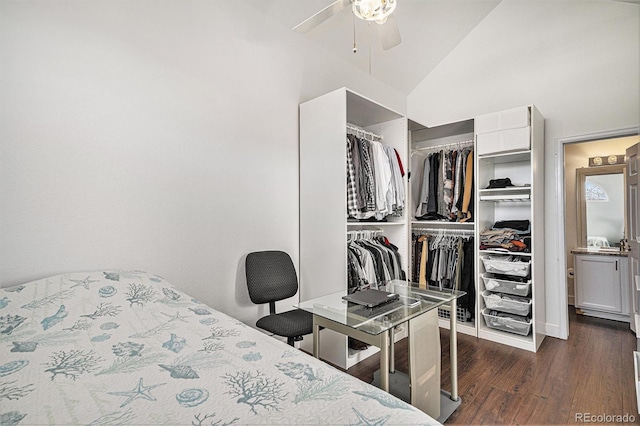 bedroom featuring lofted ceiling, ceiling fan, dark wood-style flooring, and a closet