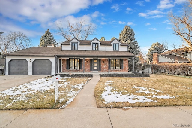 view of front of property with a garage and a porch