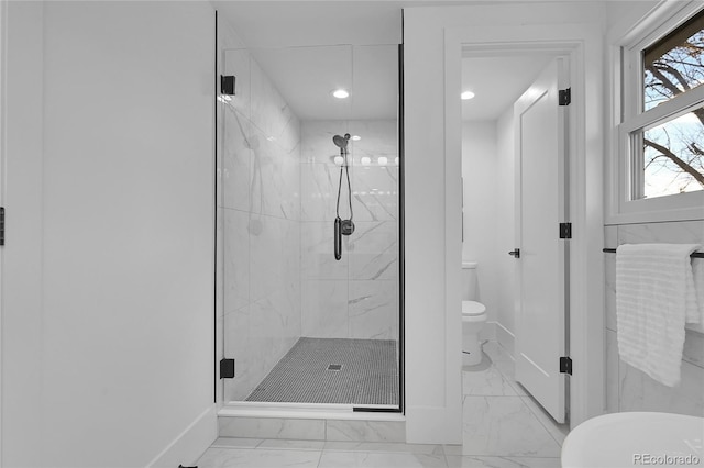 bathroom featuring toilet and an enclosed shower