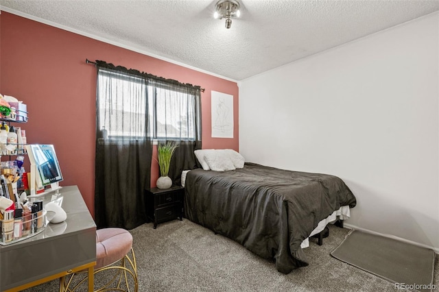 bedroom featuring carpet and a textured ceiling