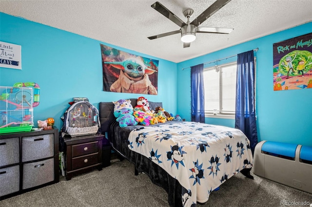 carpeted bedroom featuring a textured ceiling and ceiling fan