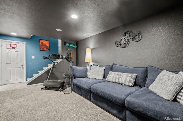 carpeted living room with a textured ceiling