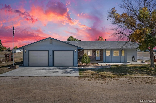 ranch-style home featuring a garage