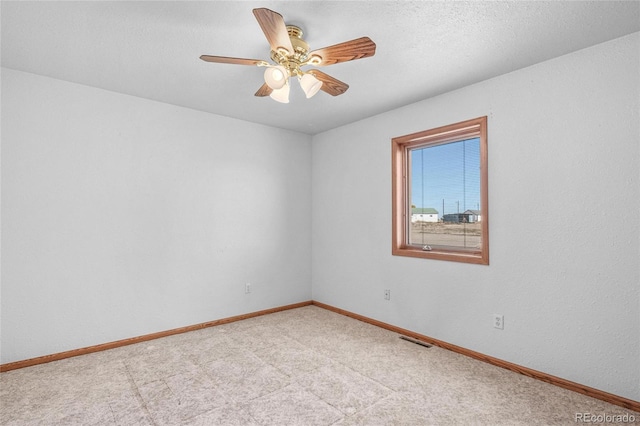 unfurnished room with ceiling fan