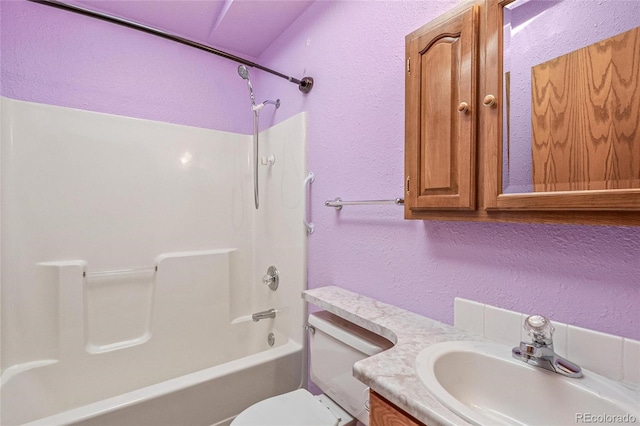 full bathroom with vanity, shower / tub combination, and toilet