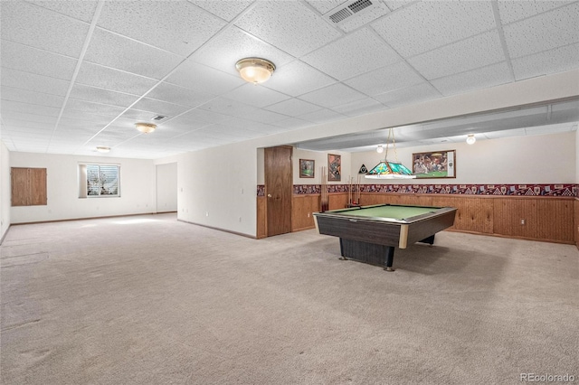 playroom with wooden walls, pool table, a paneled ceiling, and light colored carpet