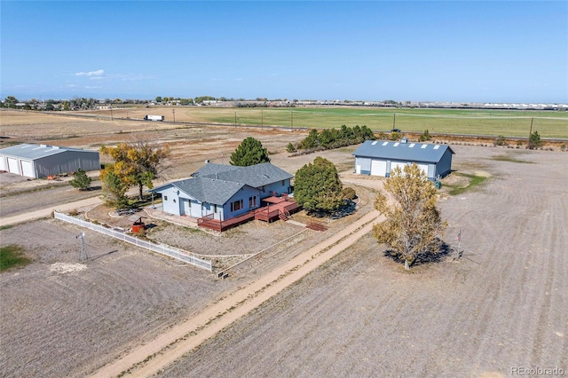 birds eye view of property with a rural view