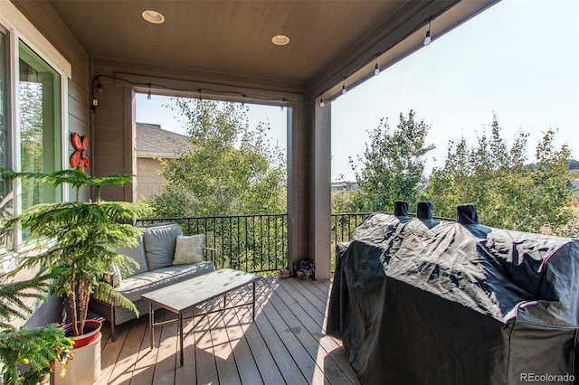 wooden terrace featuring outdoor lounge area