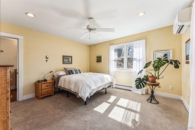 carpeted bedroom with recessed lighting, a wall unit AC, a ceiling fan, and baseboards