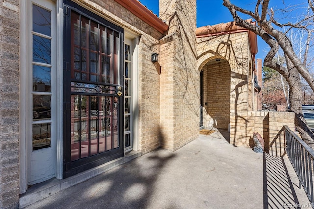 entrance to property with brick siding