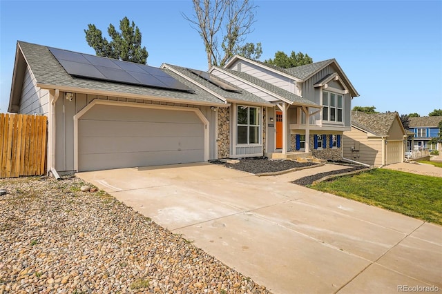 19859 E Prentice Pl, Centennial, CO 80015 - tri-level home featuring driveway, a garage, roof with shingles, roof mounted solar panels, and board and batten siding