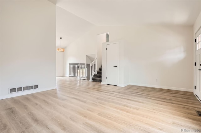 19859 E Prentice Pl, Centennial, CO 80015 - spare room with high vaulted ceiling, light wood-style floors, and stairs