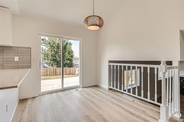19859 E Prentice Pl, Centennial, CO 80015 - unfurnished dining area featuring light wood-style flooring and baseboards