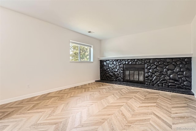 19859 E Prentice Pl, Centennial, CO 80015 - unfurnished room featuring baseboards and a glass covered fireplace