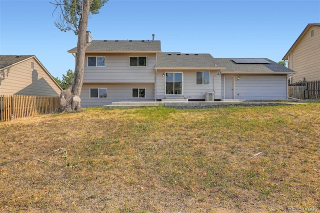 19859 E Prentice Pl, Centennial, CO 80015 - rear view of property with a patio, solar panels, and a chimney