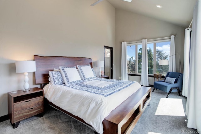 carpeted bedroom with high vaulted ceiling and recessed lighting