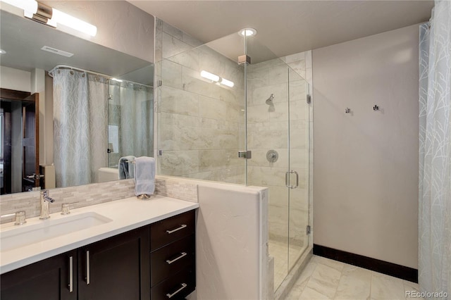 bathroom with vanity, baseboards, a shower stall, visible vents, and marble finish floor