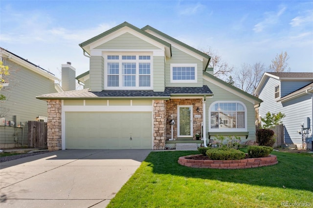 view of front facade featuring fence, stone siding, a front yard, and concrete driveway