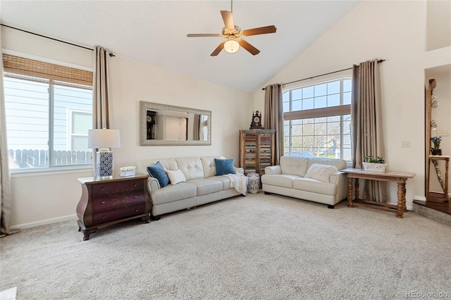 living room featuring carpet floors, a ceiling fan, and a healthy amount of sunlight
