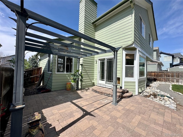 view of patio / terrace with a pergola and a fenced backyard