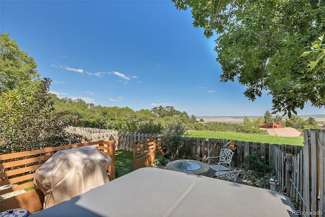 view of patio / terrace with a grill and central air condition unit