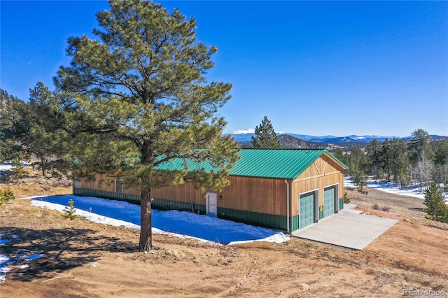 523 Pulver Rd, Lake George, CO 80827 - view of side of property with a detached garage and a mountain view