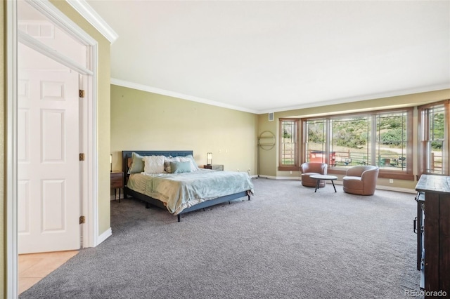 bedroom featuring ornamental molding, multiple windows, and light carpet