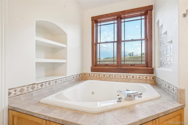 bathroom featuring a relaxing tiled tub