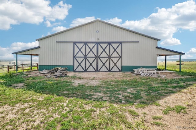 view of outbuilding featuring a rural view