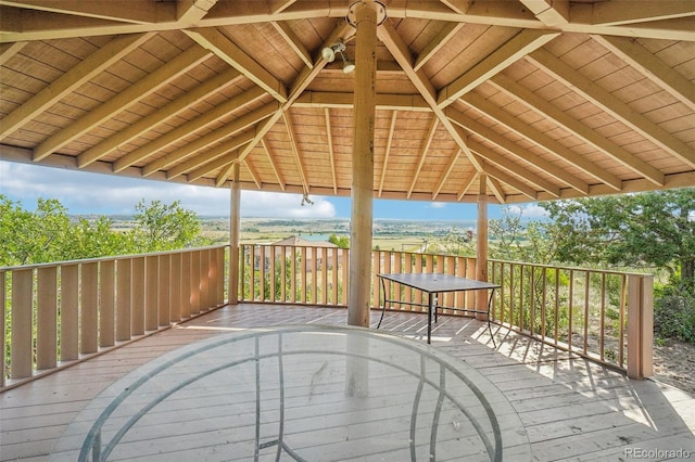 wooden terrace featuring a gazebo