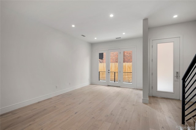 unfurnished room featuring light hardwood / wood-style flooring