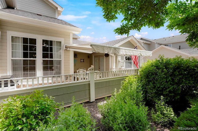 5155 W Quincy Ave Unit L101, Denver, CO 80236 - view of front of property with a shingled roof