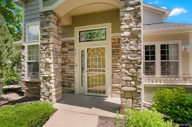 5155 W Quincy Ave Unit L101, Denver, CO 80236 - entrance to property featuring stone siding and roof with shingles