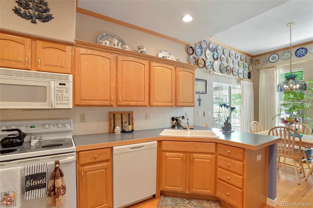 5155 W Quincy Ave Unit L101, Denver, CO 80236 - kitchen with white appliances, ornamental molding, a peninsula, tasteful backsplash, and decorative light fixtures