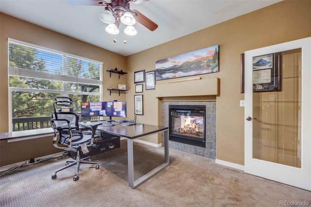 13324 W 86th Dr, Arvada, CO 80005 - office space featuring carpet flooring, ceiling fan, a fireplace, and baseboards