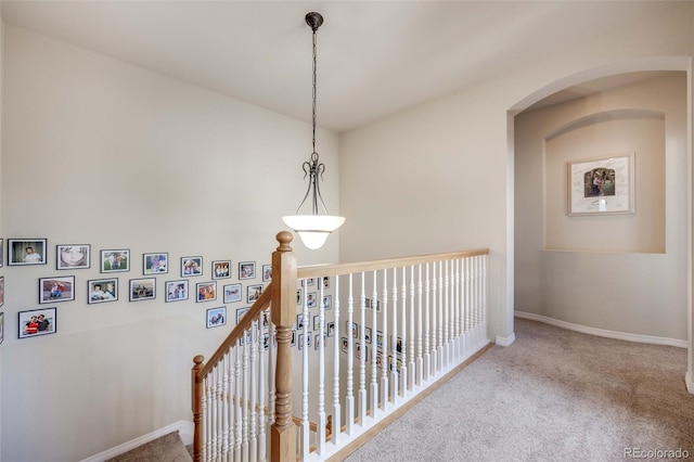 13324 W 86th Dr, Arvada, CO 80005 - hall featuring carpet flooring, baseboards, and arched walkways