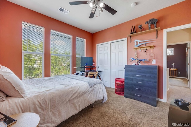 13324 W 86th Dr, Arvada, CO 80005 - carpeted bedroom featuring multiple windows, a closet, and ceiling fan
